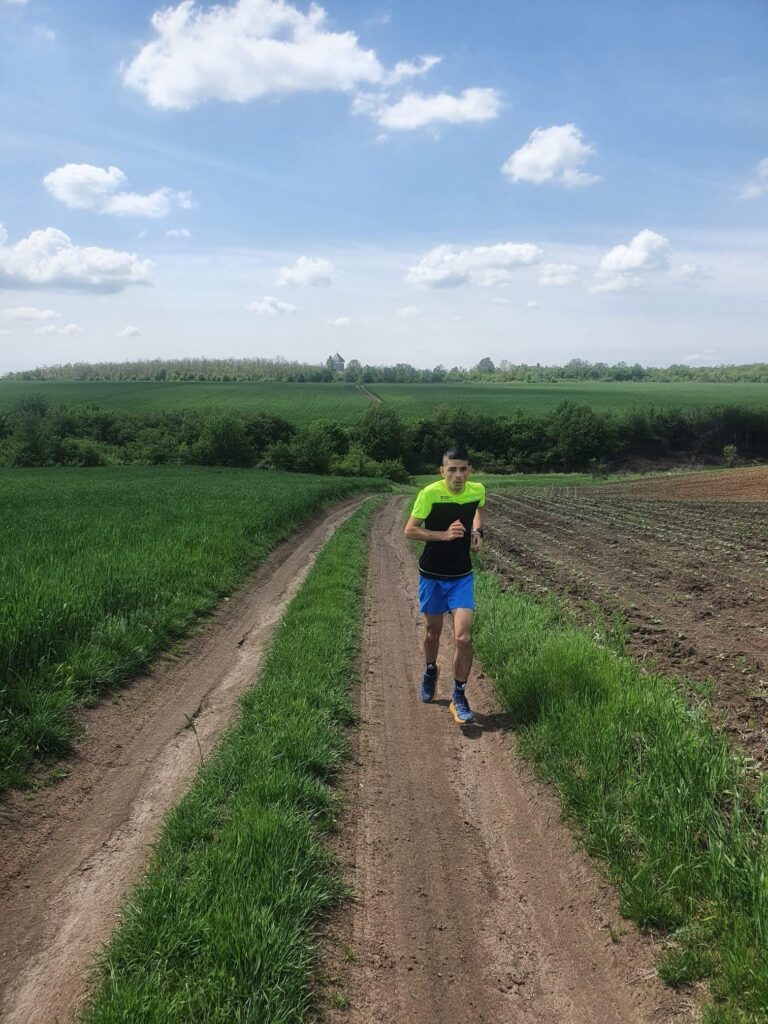 trail running in spring on forest path